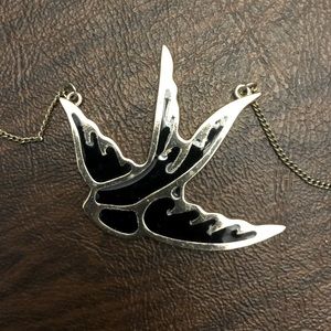 Black and gold bird pendant necklace